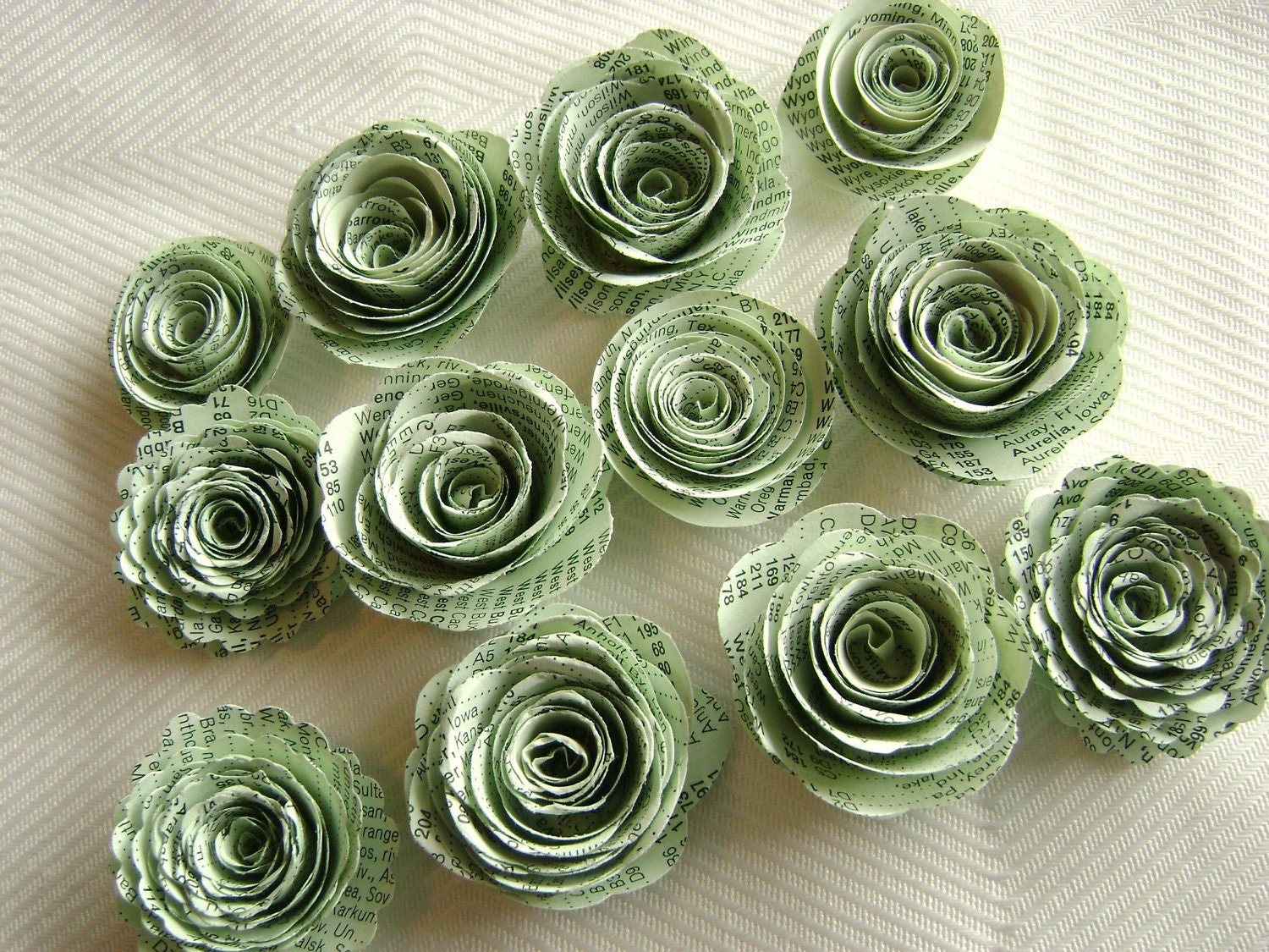 spiral paper flowers made from light green vintage atlas index book pages wedding decorations