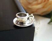 the cup of tea necklace.