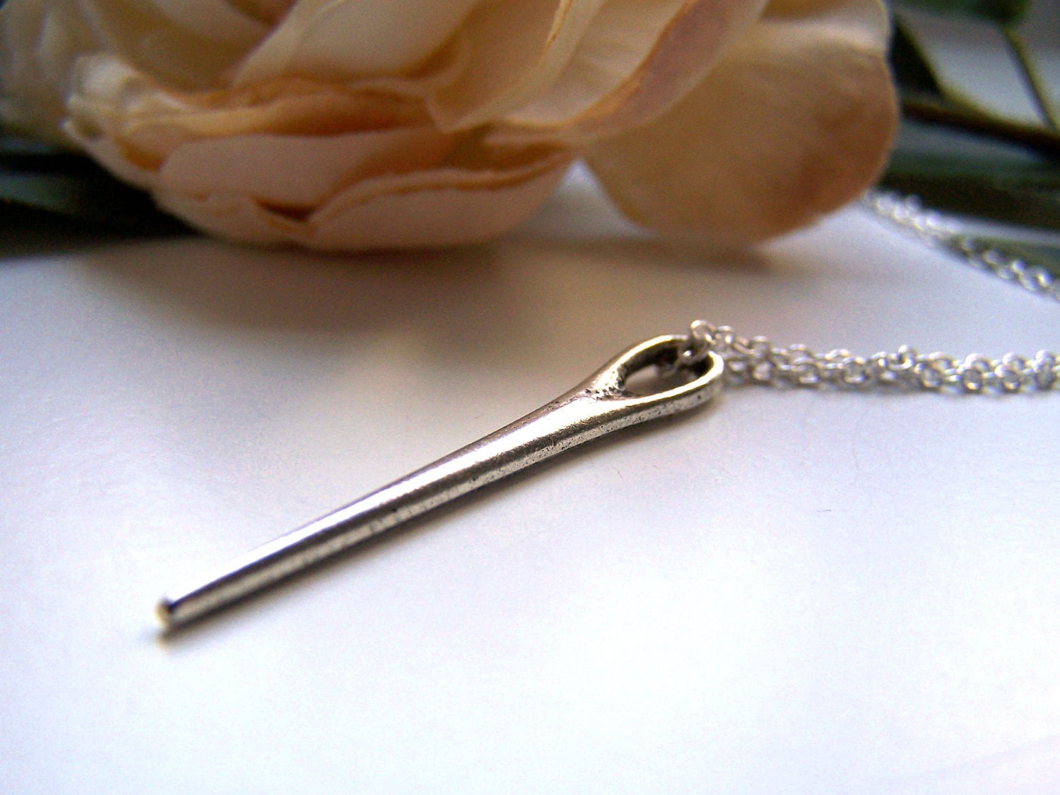 the needle necklace.
