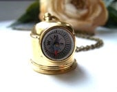 the diver's helmet compass necklace.