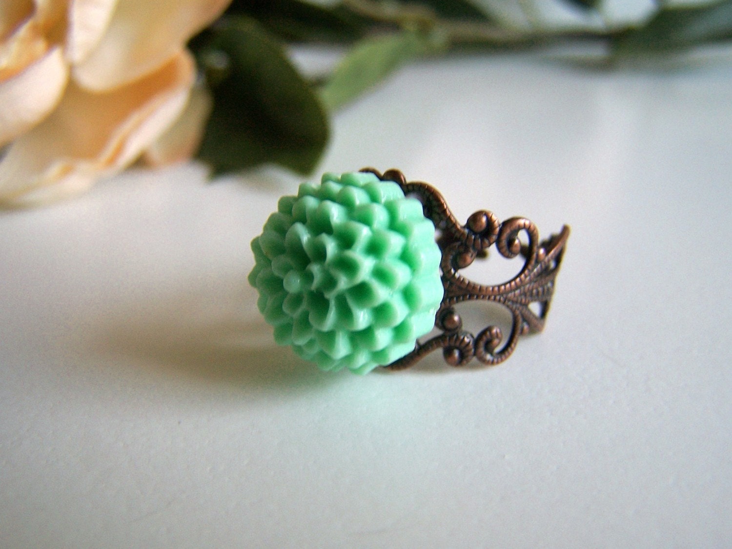 the mint pom chloe ring.