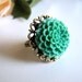 the teal daphne ring.
