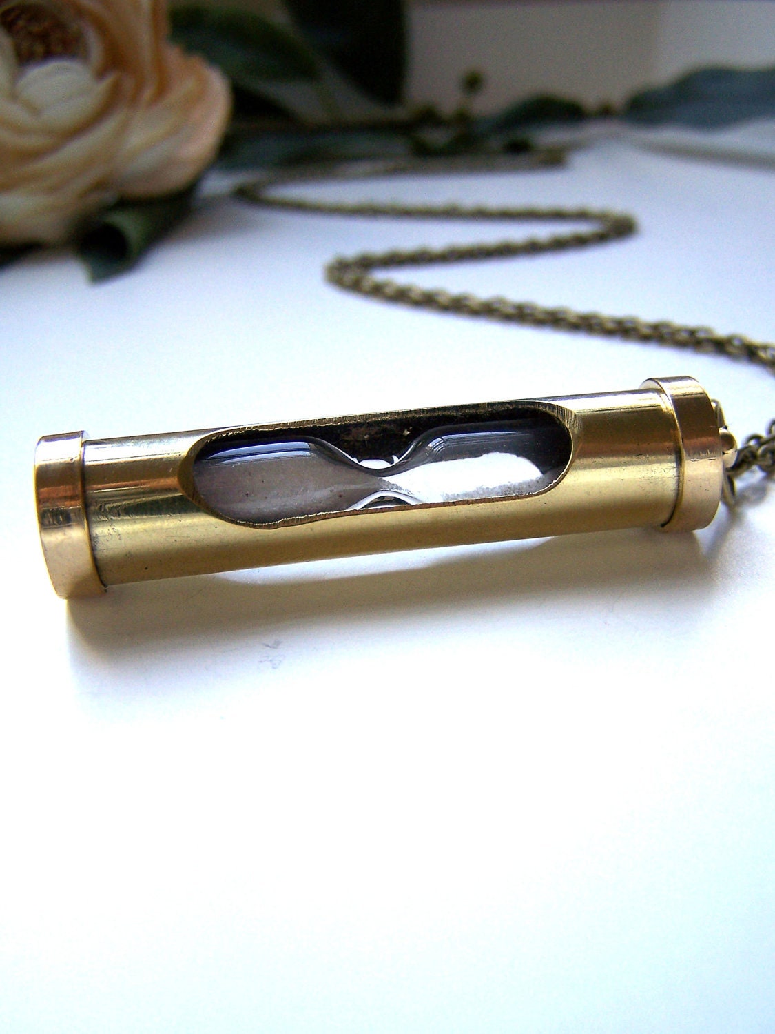 the hourglass necklace.