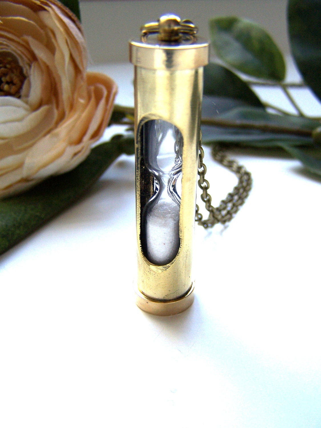 the hourglass necklace.