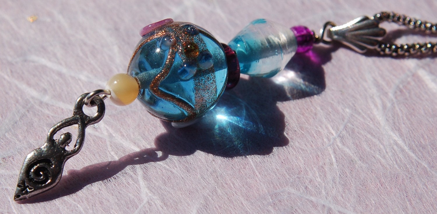 Turquoise Glass Bead Leather Necklace with Blue Lampwork Focal Bead and Eternity Goddess Charm