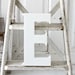 large E sign letter