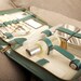 Green leather travel case with manicure set mirrors and bottles