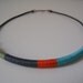 The embroiderer's necklace: colorblock necklace in fern green, pewter gray, orange spice and light turquoise