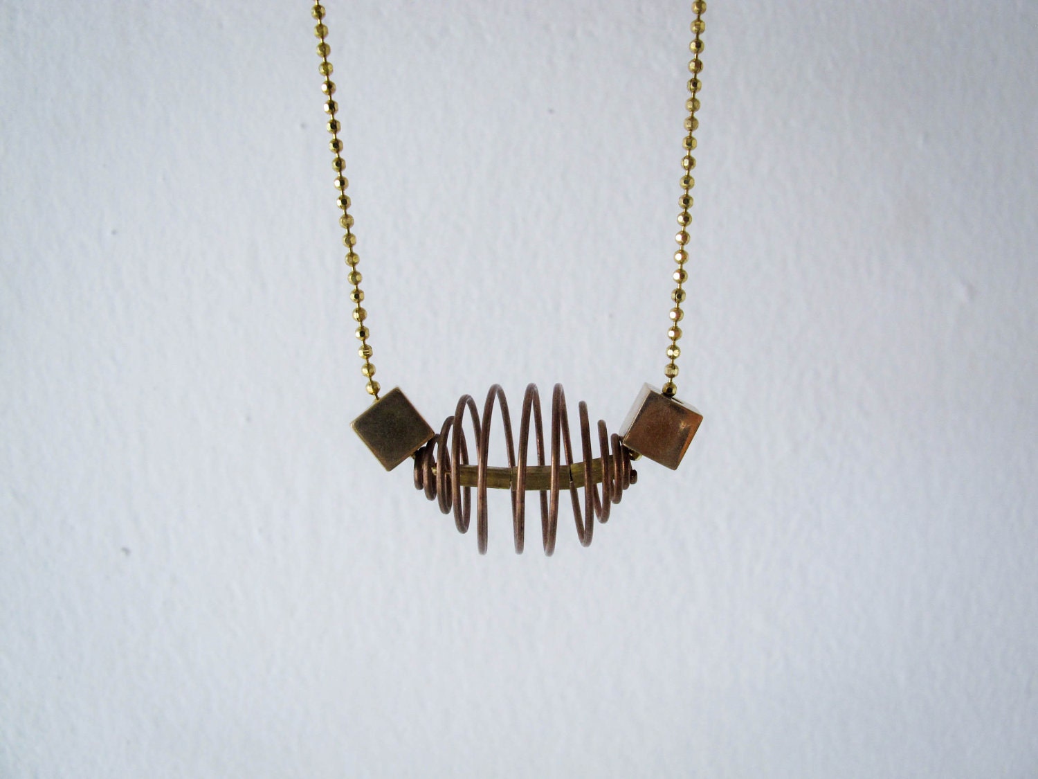 Swirl - simple geometric vintage red brass coil cage charm necklace