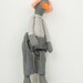 Bird Doll - gray  duck  Wearing White & gray stripes Shirt , jeans  pants  And a white hat with orange dots - handmade
