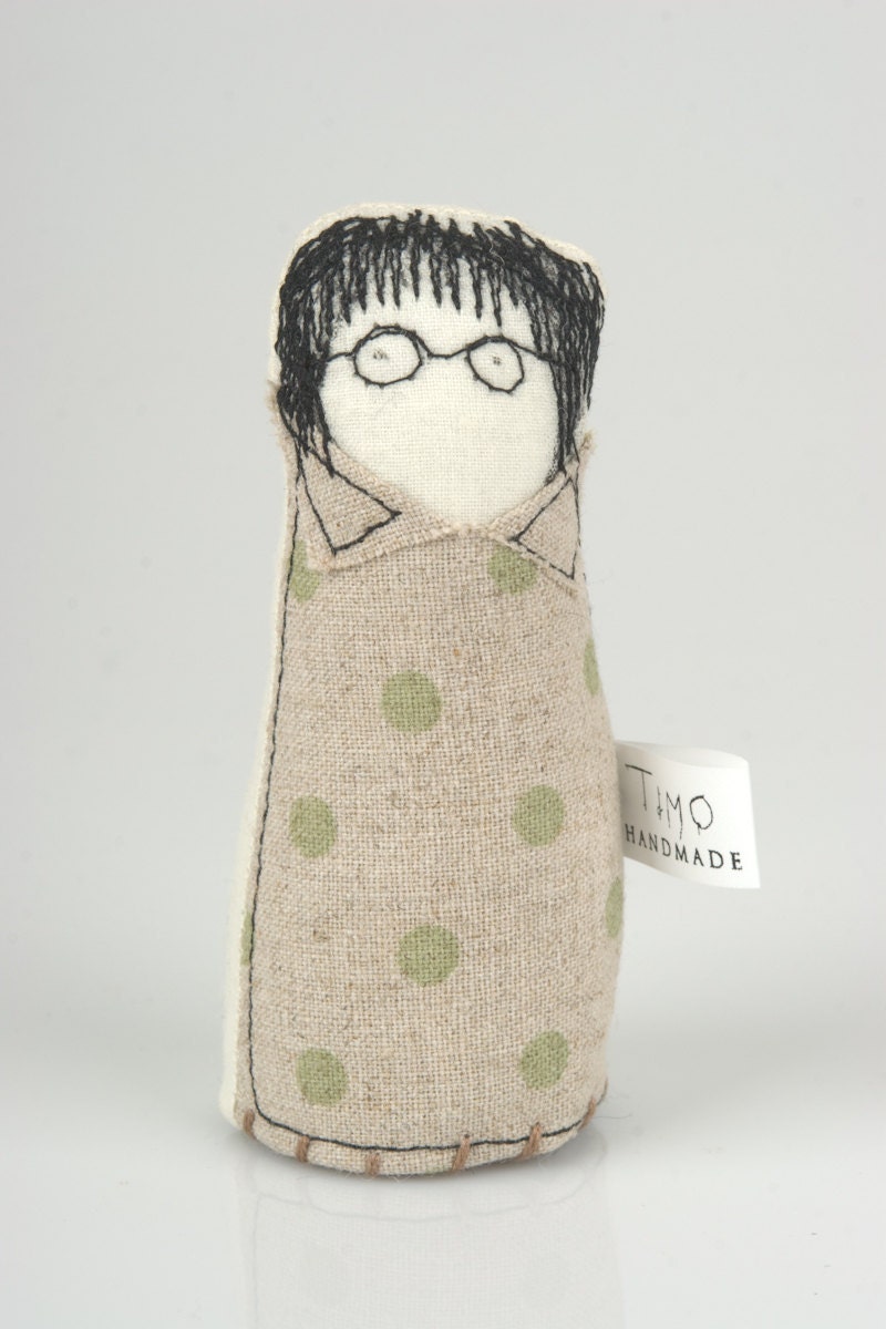 Boy and girl - little twins, she wearing glasses and a dress and he green polka-dot shirt and corduroy