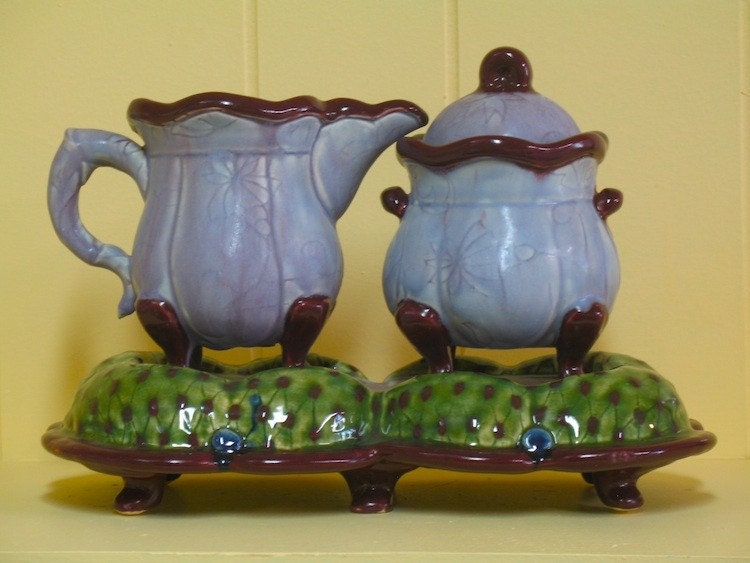 Cream and sugar on stand in lavender