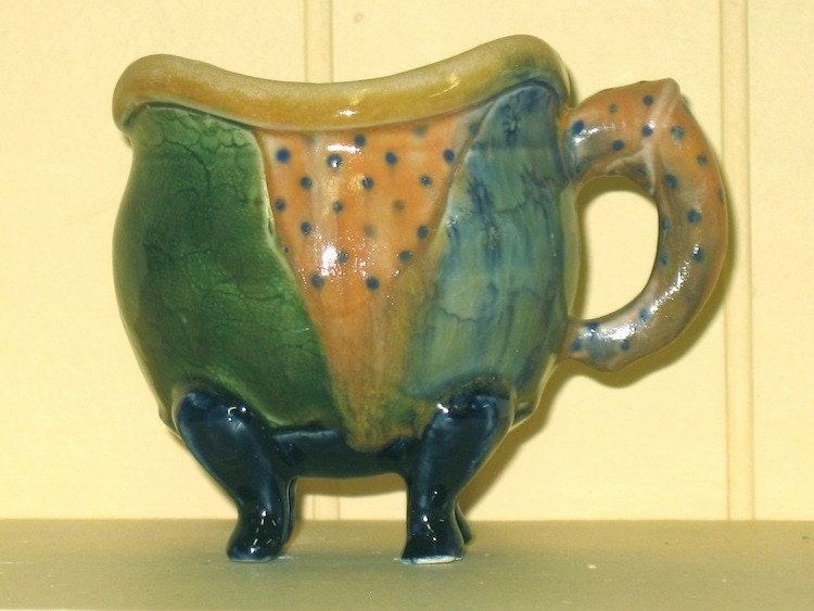 cup in green, peach, and blue