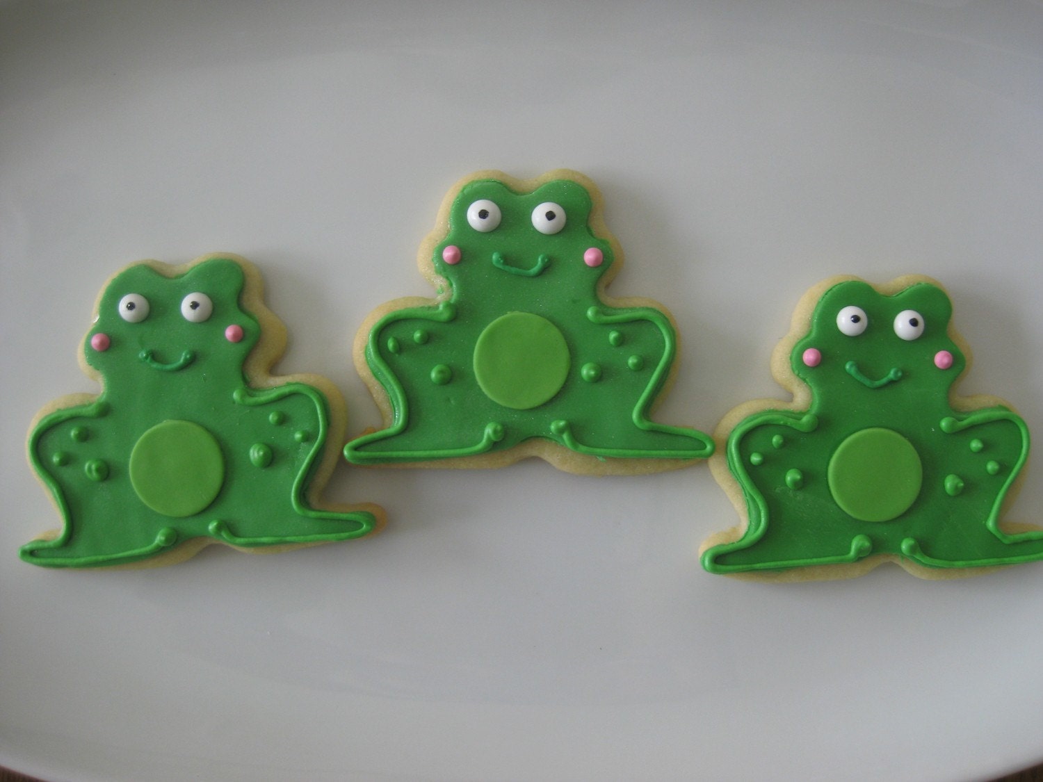 Adorable frog cookies will be all the Ribbit at your next party or get together. Set of 12 decorated frog sugar cookies.