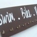 triathlon: swim bike run  Display your triathlon bibs and medals