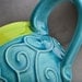 Curly Mug: Caribbean Blue and Neon Green Slip Trailed Mug by Symmetrical Pottery