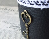 Black Handmade Leather Cuff with Lace and brassy key charm.  Pretty, unique, and adjustable.
