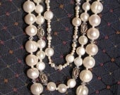 Beautifully beaded triple strand pearl and crystal necklace