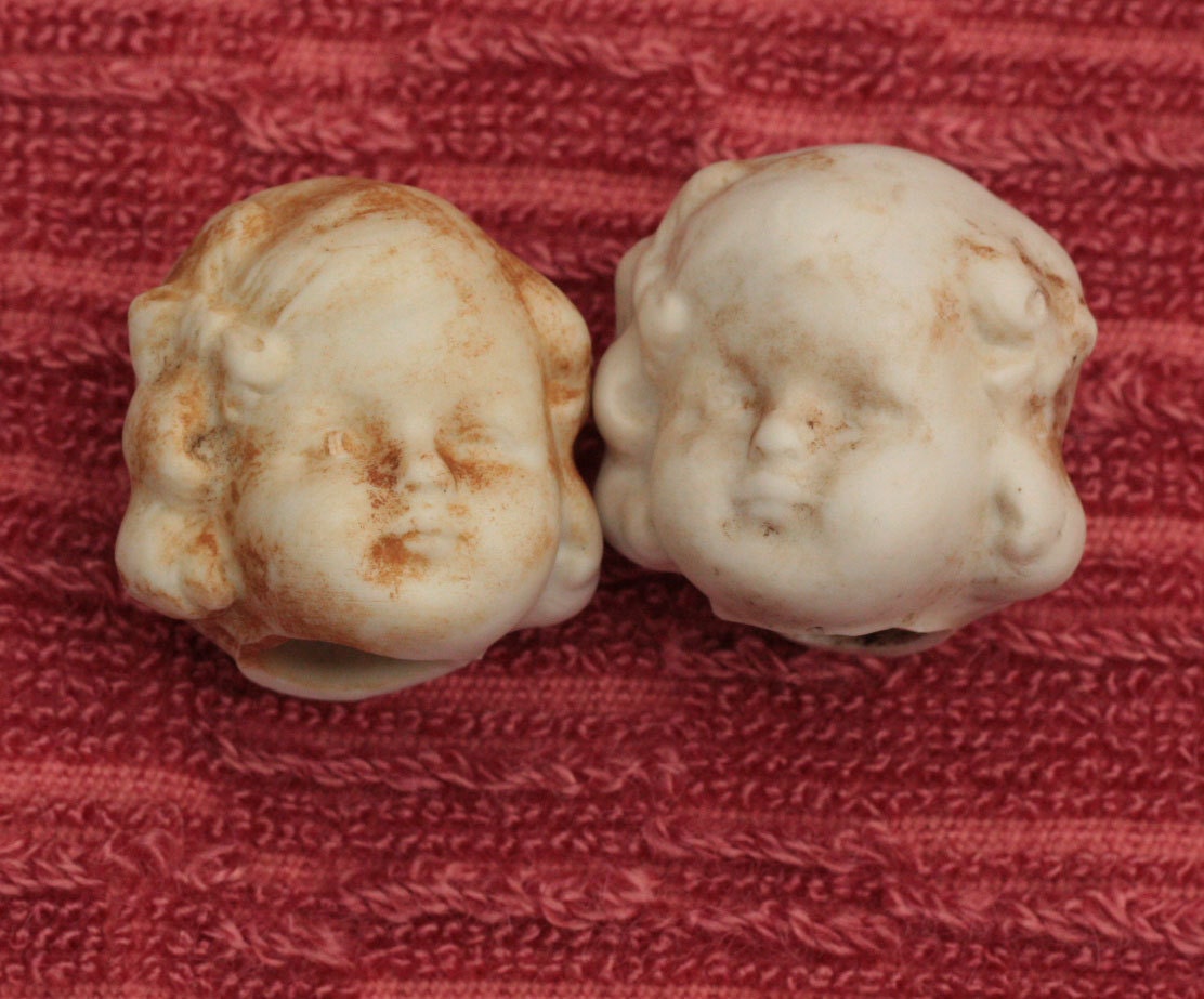 Antique Doll Heads Rusty Unglazed Porcelain
