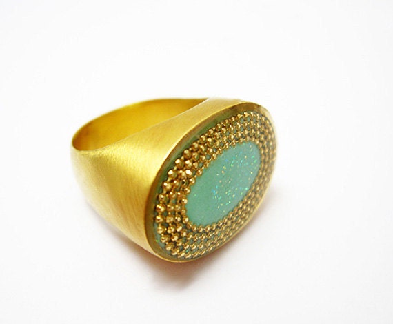 Oval Mint green ring made of gold filled, oval green center surrounded by golden dots, cold enamel finish,