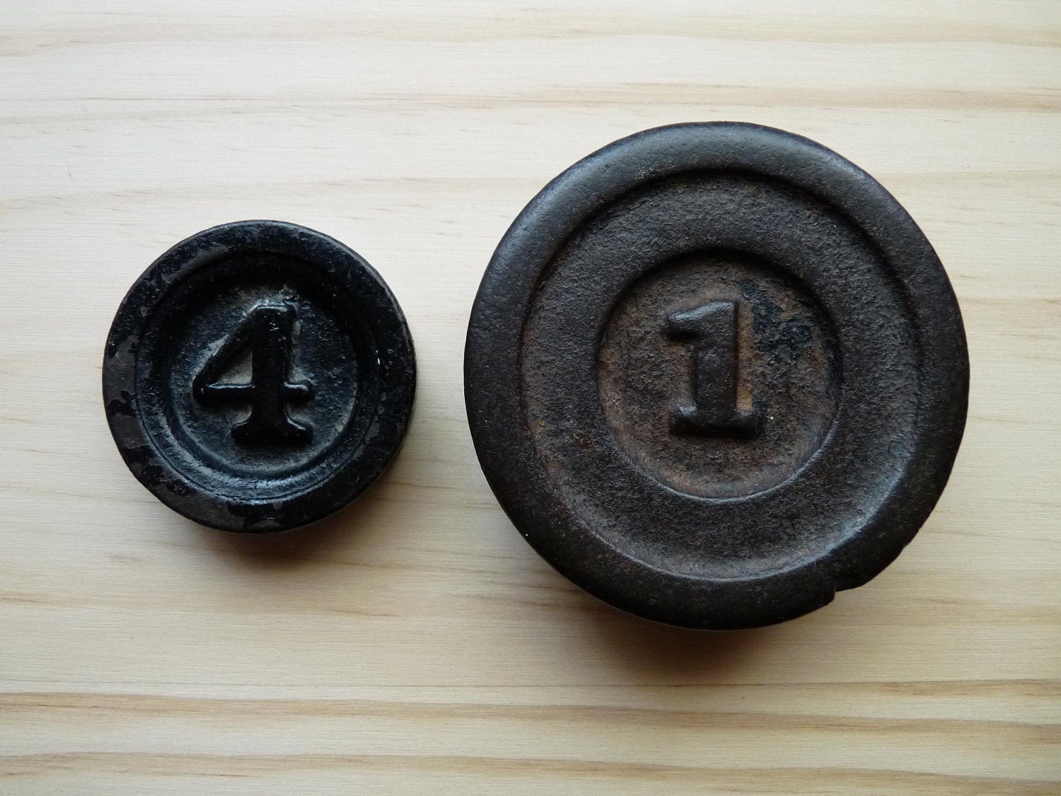 Two Cast Iron Lead Kitchen Scale Weights 1 lb and 4 oz Prim Primitive Farm Farmhouse Rustic Cabin