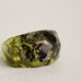 Lichen and moss eco resin ring with soft rectangular facets.