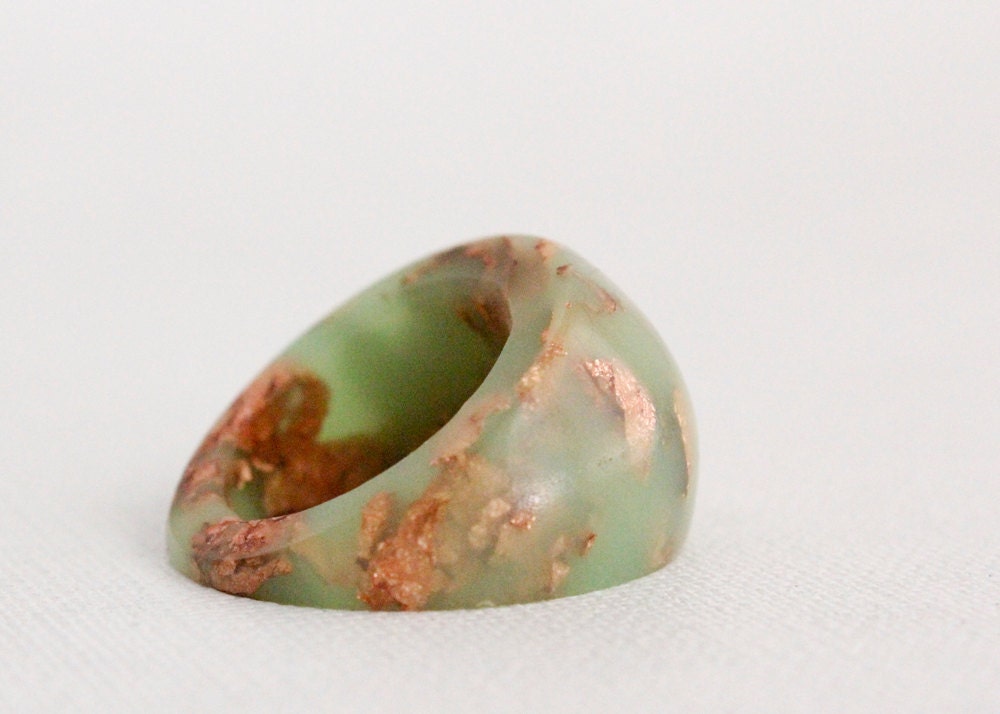 neon green dome ring with suspended copper flakes eco resin