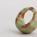 neon green dome ring with suspended copper flakes eco resin