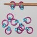 Medium silver lined aqua on pink stitch markers