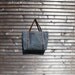 Waxed canvas bag/ carry all with leather handles and double buckle closure with straps COLLECTION UNISEX