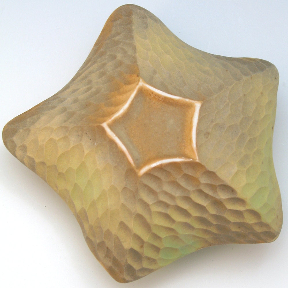 Carved porcelain starfish in yellow, green & golden brown