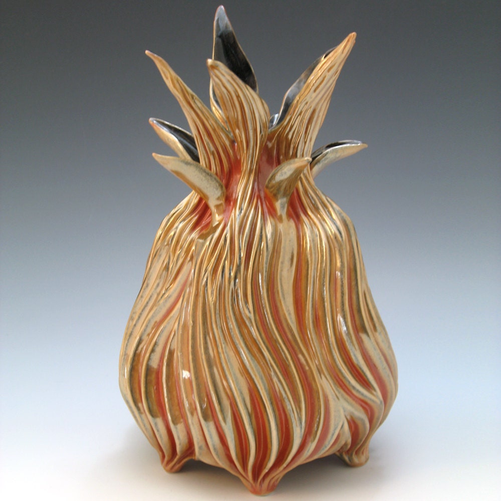 Luster shino fiery gold & orange spikey porcelain vessel with black interior