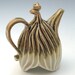 Purple, tan and white carved porcelain teapot