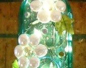 Turquoise and White Floral-Themed Glass Bottle Light