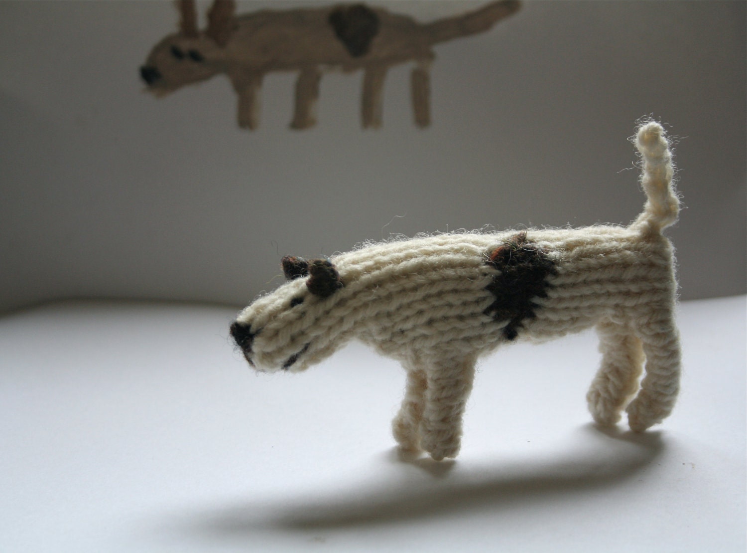 Little hand knitted patch dog