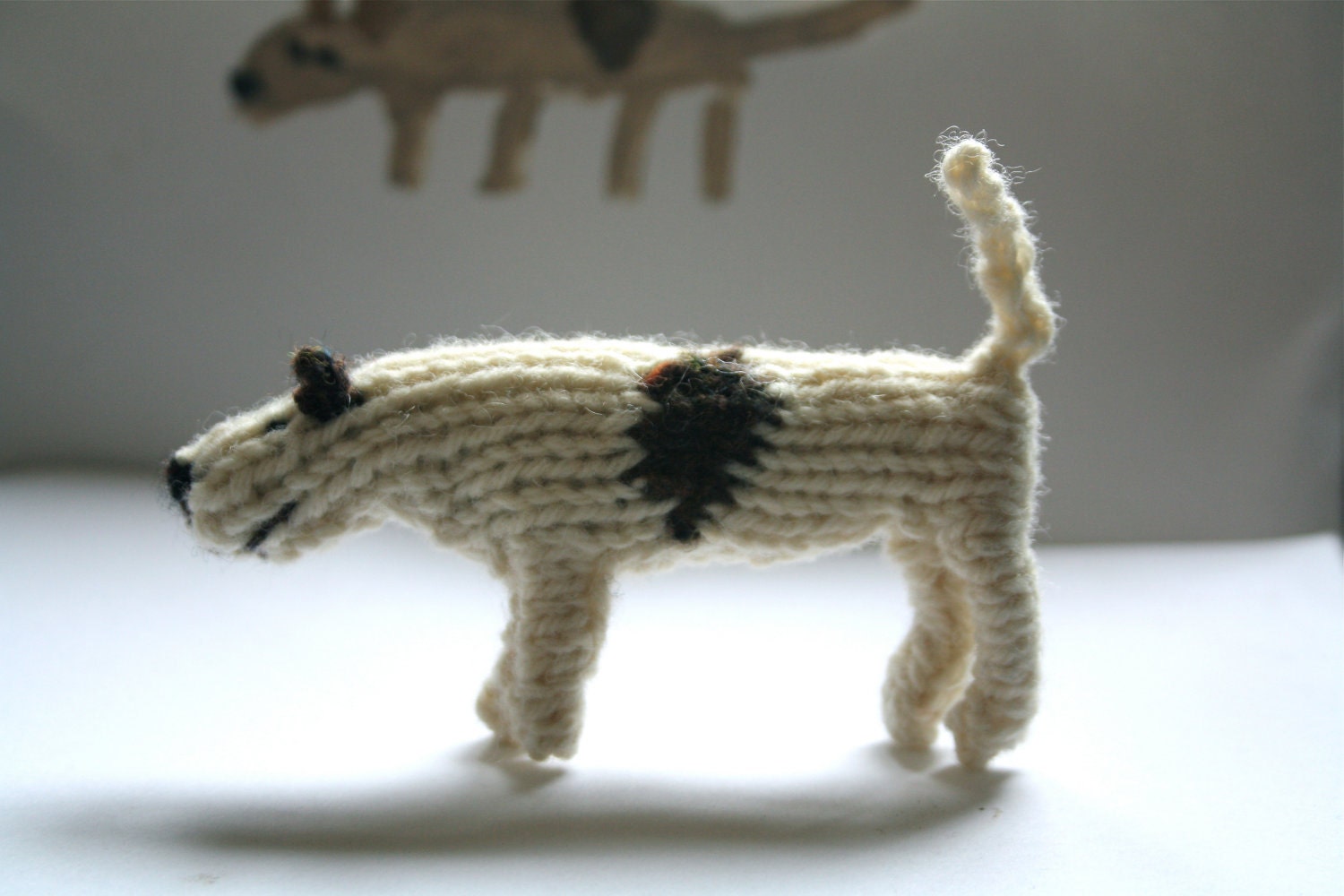 Little hand knitted patch dog