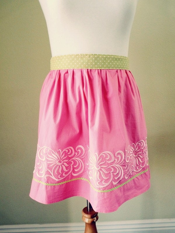 Upcycled pink embroidered half apron with green polka dot ties