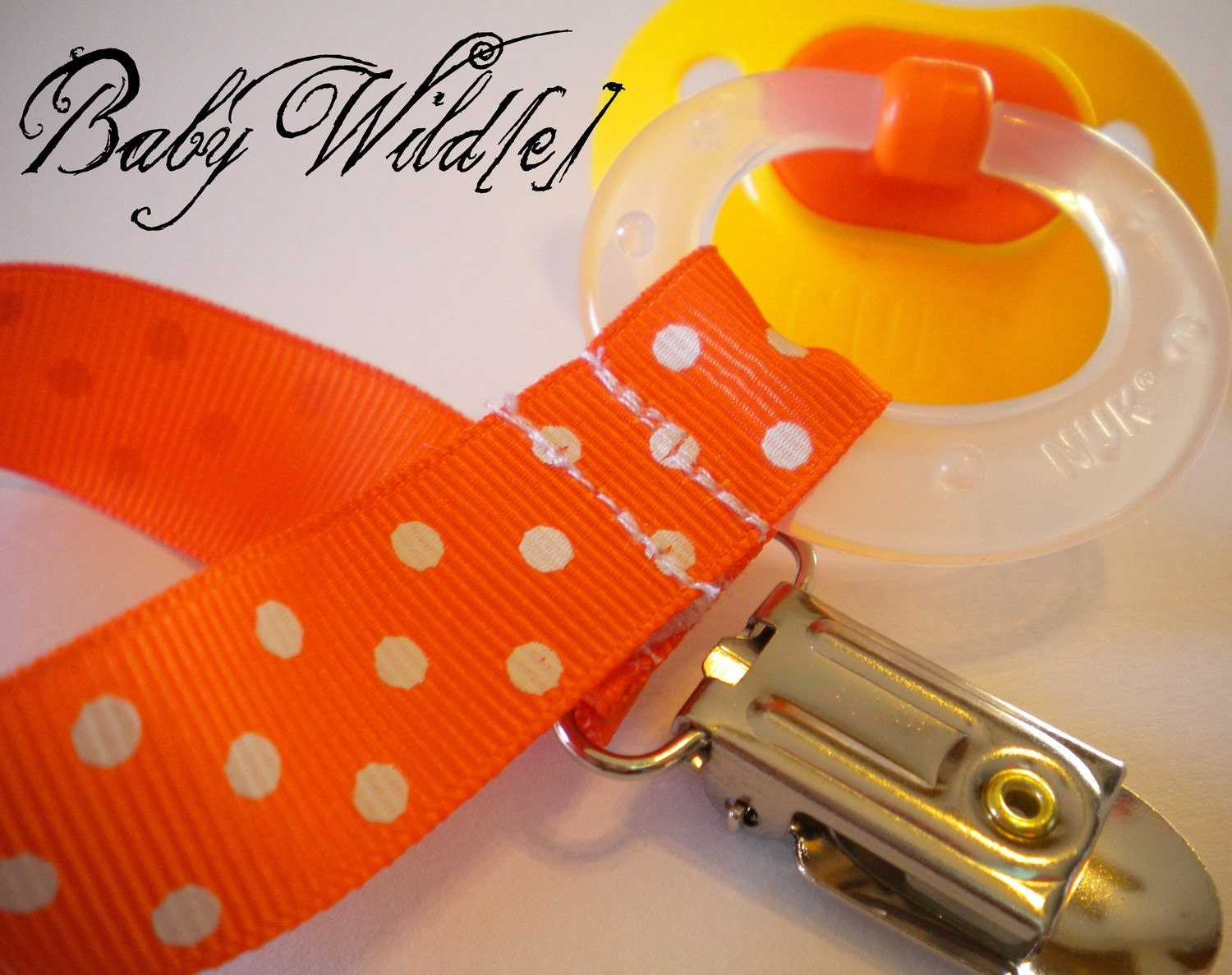 Cowboys - Orange Polka Dot Pacifier Clip