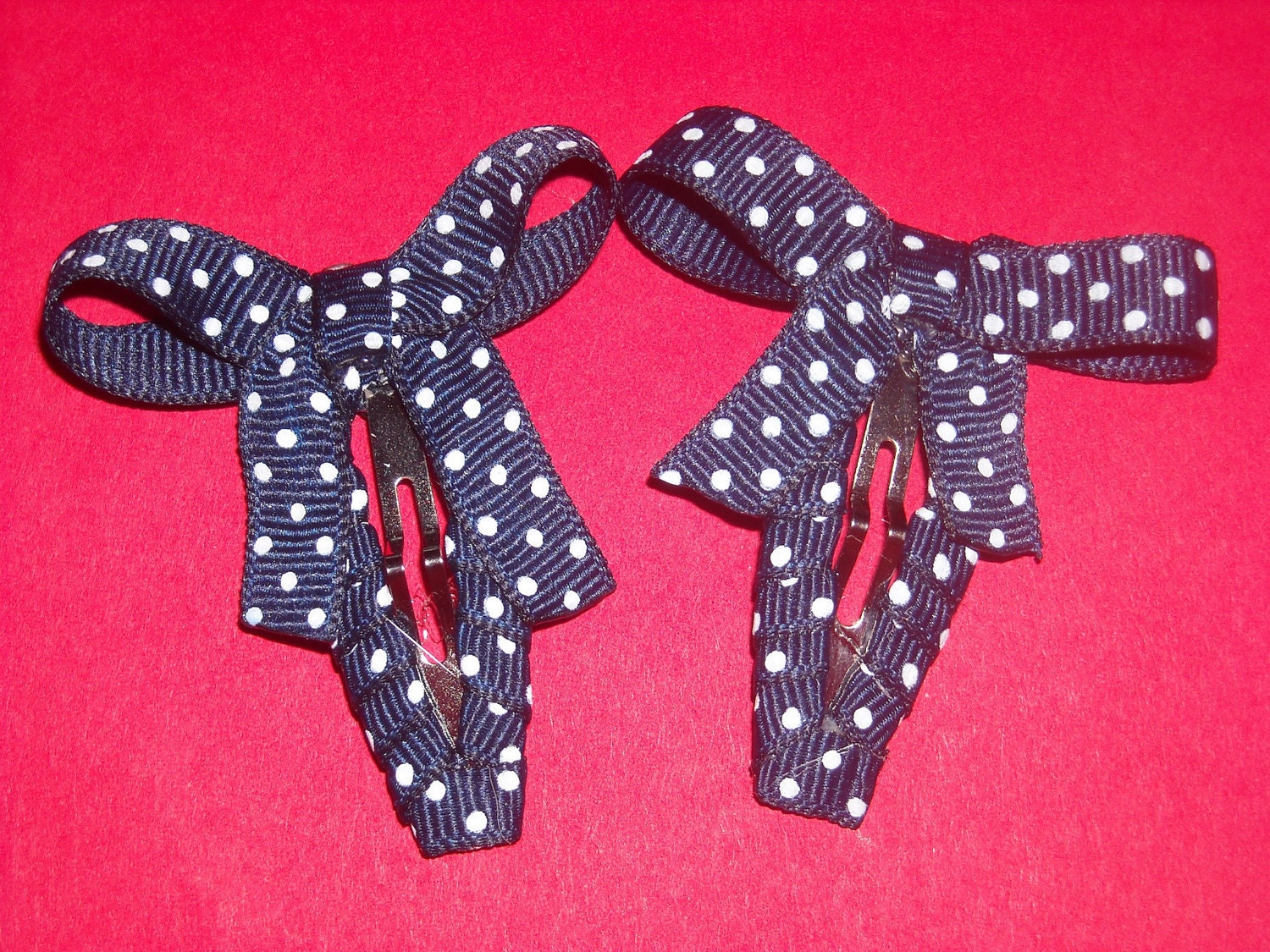 Pair Of Navy/White Polka Dot Snap Clip