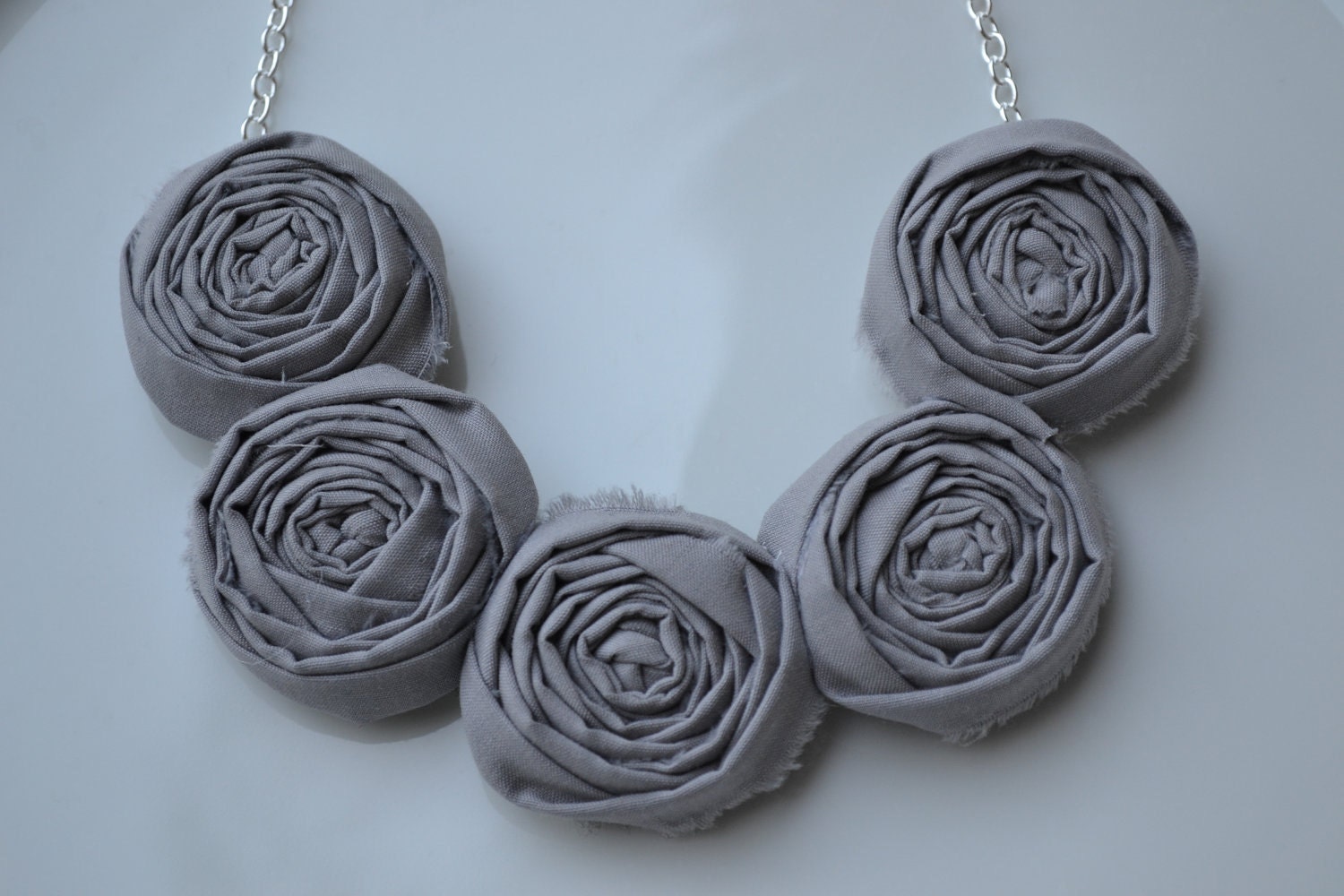Grey fabirc rolled rosette necklace