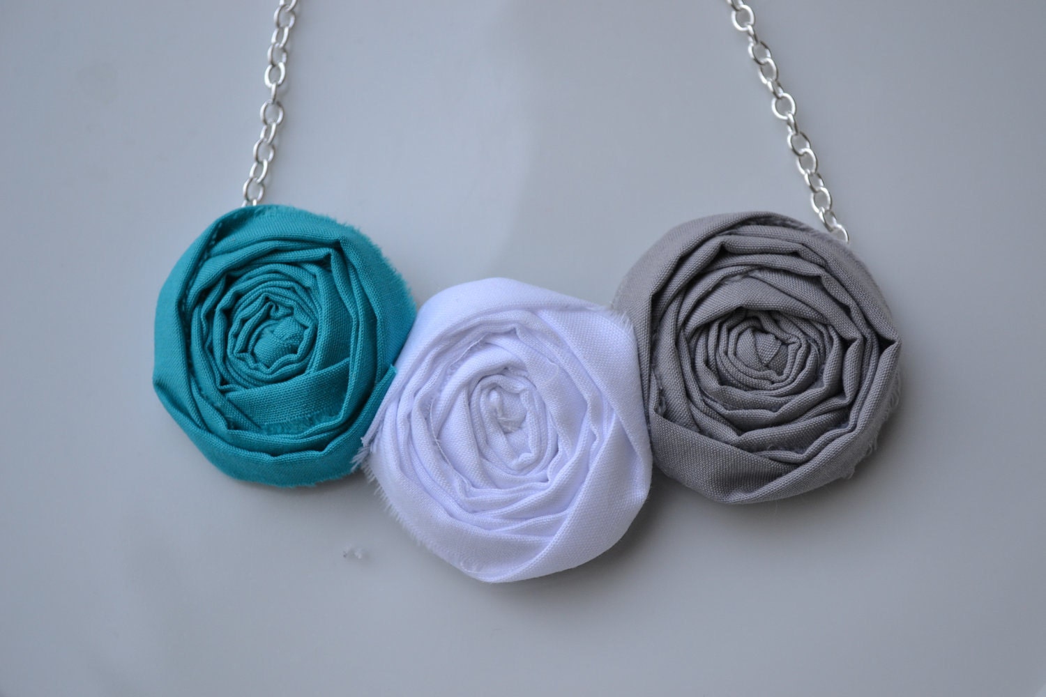 Trio of Grey, White and Teal rosette necklace