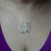 1 1/8" diameter,14k yellow gold monogram on 16" anchor cable chain .
