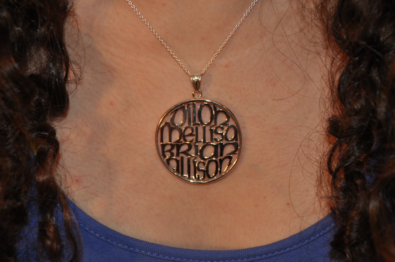 your kids or grandkids names in 1.50" circle in silver. with a cable chain.