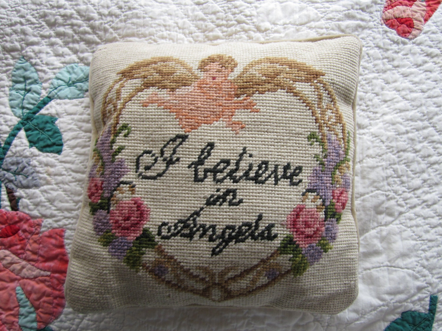 Needlepoint pillow with "I believe in Angels"