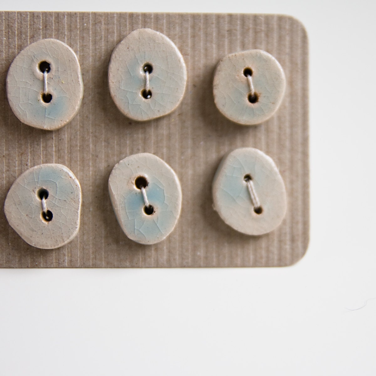 handmade ceramic buttons, baby blue, small, irregular, unique. set of 6. karoArt ceramics, handmade in Ireland