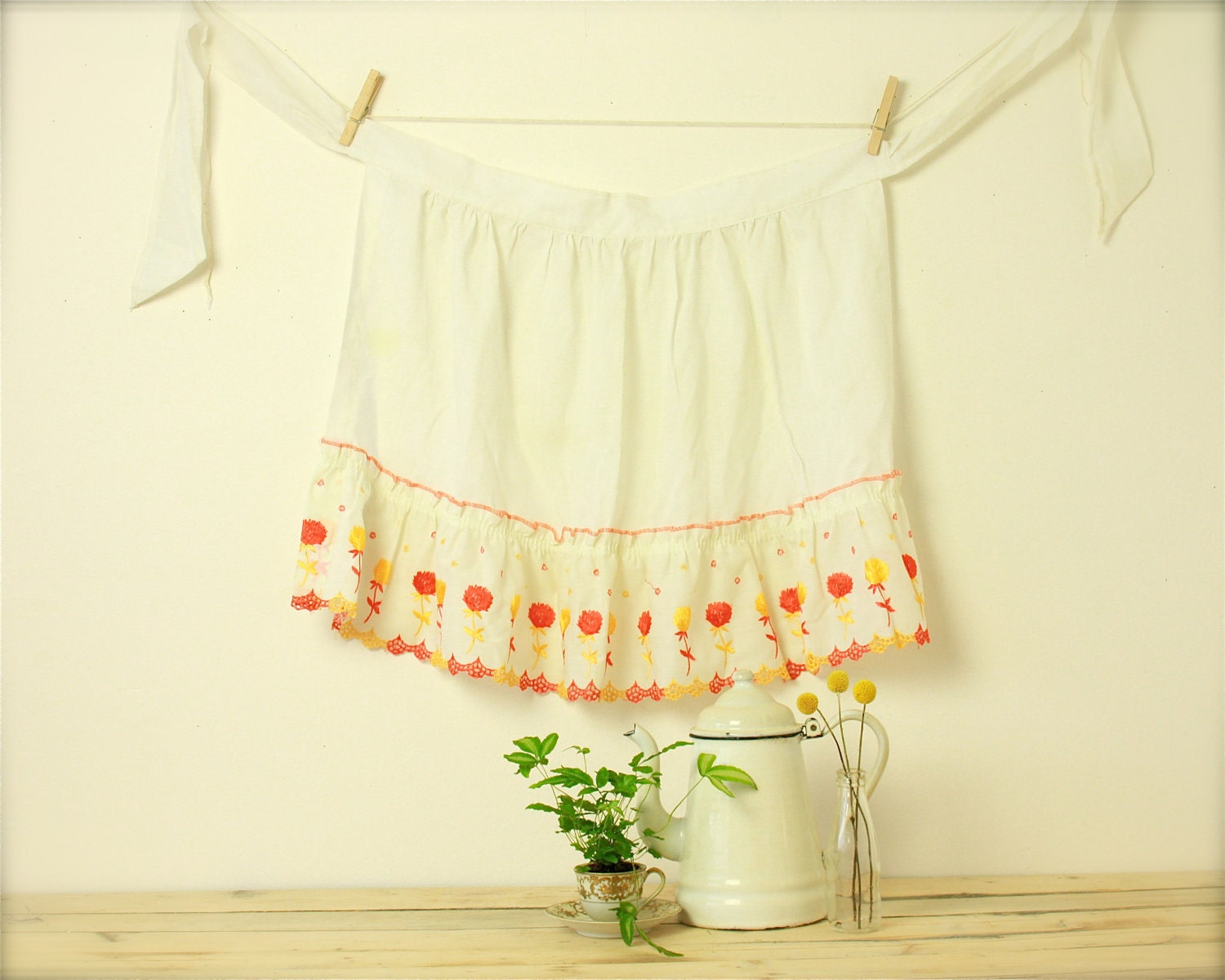 vintage apron with embroidered orange and yellow flowers