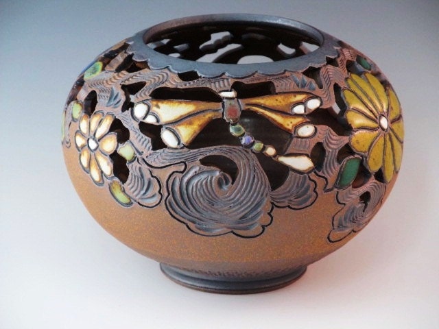 Round Vase Wtih Cutouts, Flowers, And Dragonflies With Swirl Design