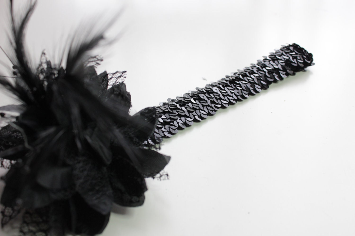 1920s black feather flapper headband races