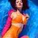 36-38 B Neon Orange PVC bra with adjustable plastic snap back and halter strap Artifice (photoshoot sample)