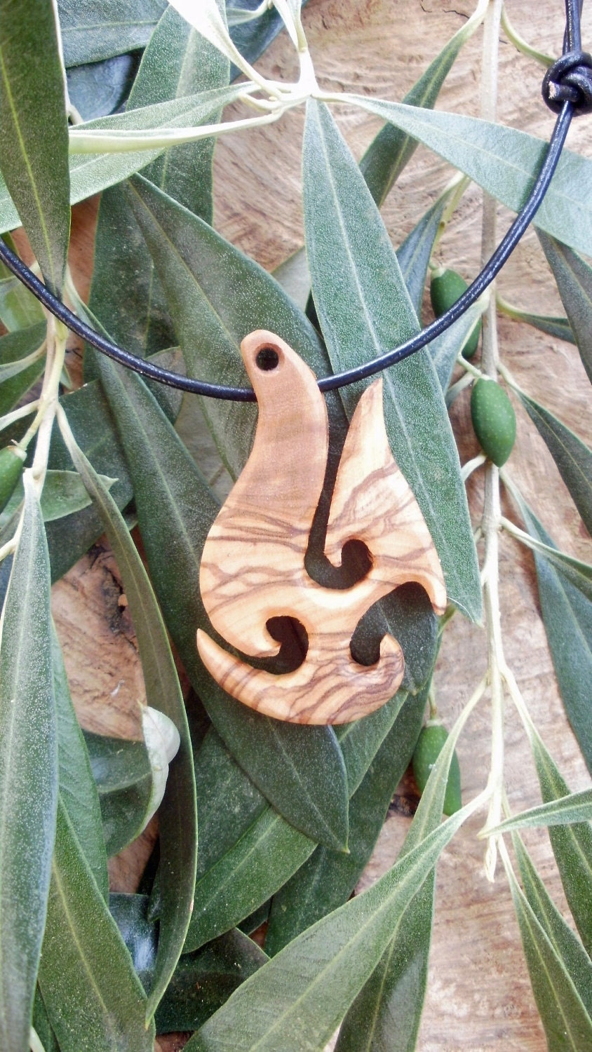Olive Wood Maori style fish hook necklace a symbol of Prosperity and Abundance